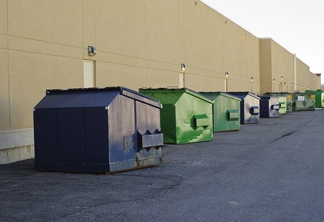 red and green waste bins at a building project in Powers, OR